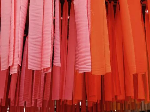 Full Frame Background of Orange and Pink Hanging Decorative Fabric Stock Photos