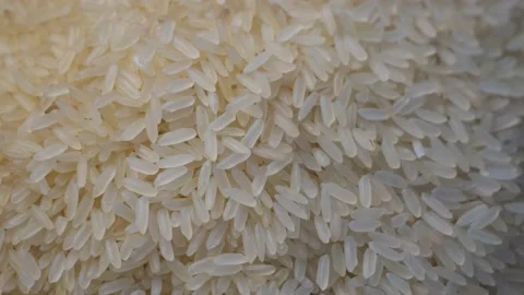 Full frame background of raw white rice ... | Stock Video | Pond5