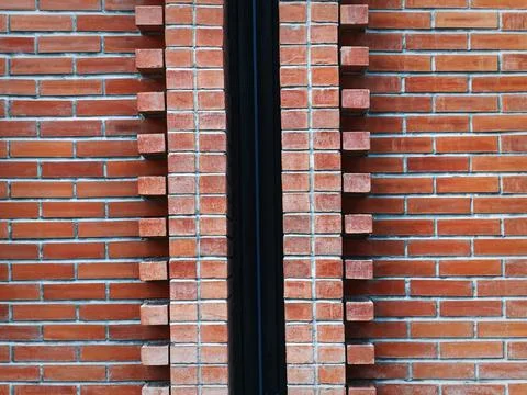 Full Frame Background of Red Brown Brick Wall with Pipe in the Middle Stock Photos