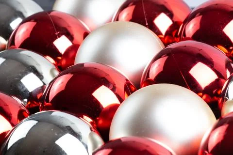 Full frame background of red, silver and white mirror balls close-up with Stock Photos