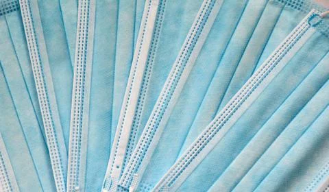 Full frame background shot of blue surgical masks Stock-Fotos