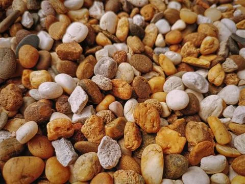 Full Frame Background of Small Brown and White Pebble Stones Stock-Fotos