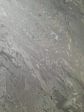 Full frame background texture of metallic silver grey fabric with wavy patt.. 스톡 사진