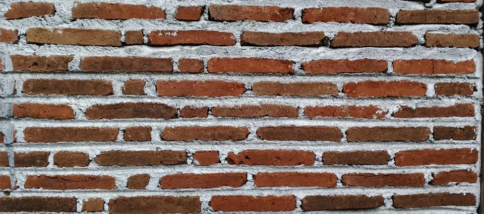 Full frame background texture of an old red brick wall with rustic blocks Stock-Fotos