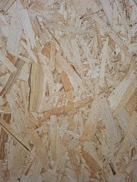 Full frame background texture of oriented strand board made of compressed w.. Stock Photos