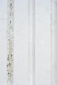 Full frame background texture of a white painted concrete wall with vertica.. Stock Photos
