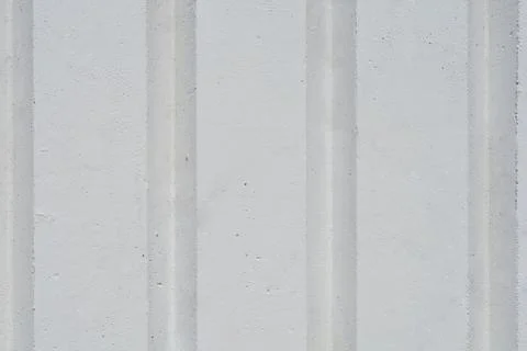 Full frame background texture of a white painted concrete wall with vertica.. Stock Photos