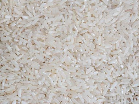 Full Frame Background of Uncooked White Rice Grains Stock Photos