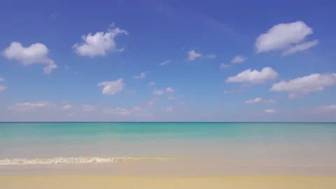 Full frame beach sea clear sand cloud water wave blue sky background Stock Footage 151028259