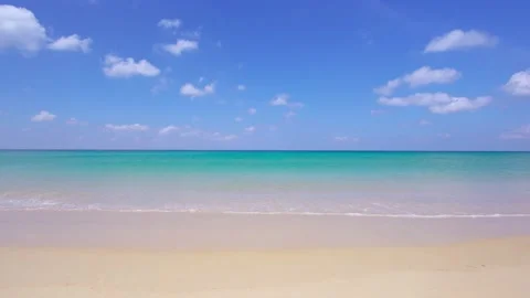 Full frame beach sea clear sand cloud water wave blue sky background Stock Footage 151028323