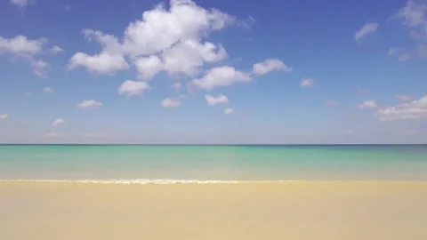 Full frame beach sea sand clear cloud water wave blue sky background Stock Footage 151028041