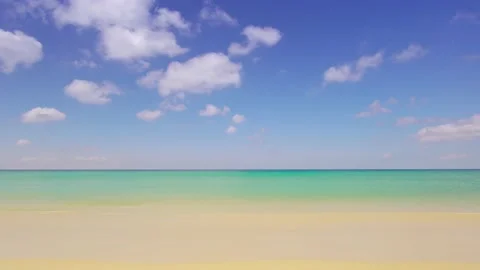 Full frame beach sea sand clear cloud water wave blue sky background Stock Footage 151028164