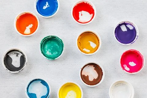 Full-frame close-up background of gouache paint jar caps Stock Photos