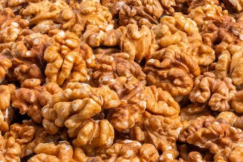 Full frame close-up background of walnuts pile without shells Stock Photos