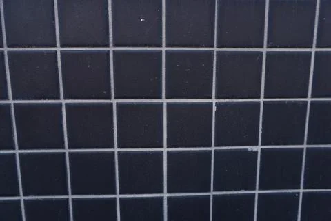 A full-frame close-up of dark blue square mosaic tiles Stock Photos