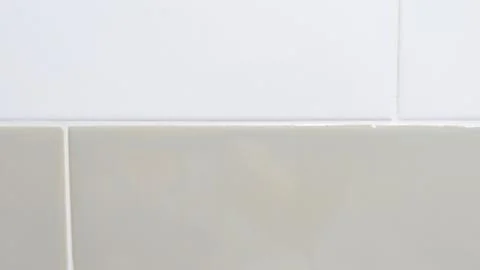 Full frame close up image of beige and white bathroom tiles Stock Photos