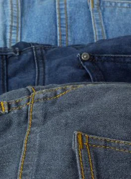 Full frame close up of two black and blue jeans with seam and other details. Foto stock