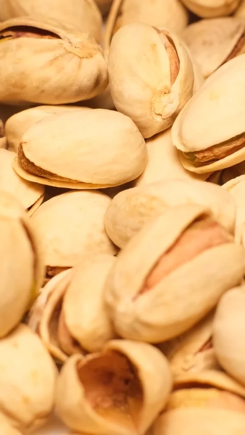 Full frame closeup shot showing lots of roasted pistachio fruits. Healtii Stock-Footage 250384918