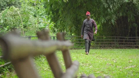 Full frame of a confident walking and smiling Yoruba business man. 스톡 동영상 283984768