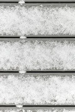 Full Frame Flatlay of A Thin Fresh Layer of Graupel Snow on Gray Deck Boards Stock Photos