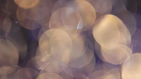 Full-frame golden bokeh with colored light overlay Video stock 318663765