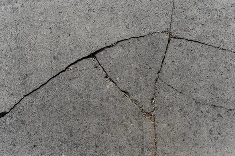 Full frame grey basalt lava stone texture, cracked natural volcanic paving Stock Photos