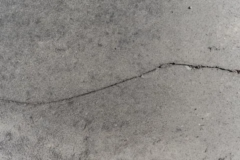 Full frame grey basalt lava stone texture, cracked natural volcanic paving Stock Photos