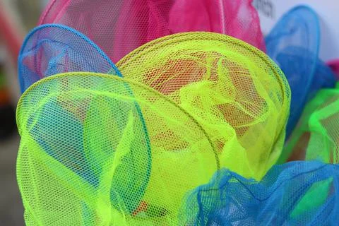 Full frame image of assorted nylon fishing nets in bright colours Stock Photos