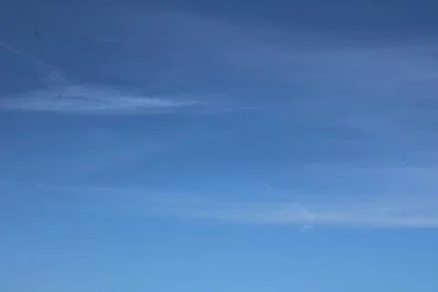 Full frame image of blue sky with wispy cloud formation Stock Photos