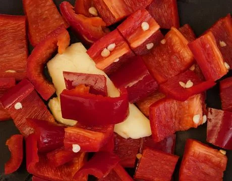 Full frame image of chopped red capsicum and butter ready for cooking Stock Photos