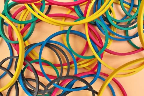 Full Frame Image Flatlay of Multicolored Elastic Rubber Bands on a Cheerful Stock Photos