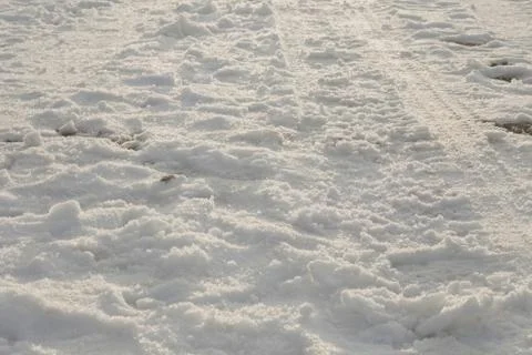 Full Frame Image of Snow Covered Ground with Sled and Foot Prints Stockfoto's