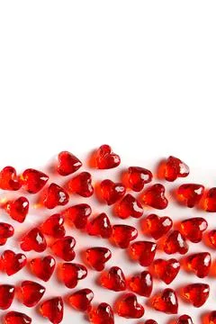 Full Frame Image of Sparkling Red Gemstone Hearts on a White Studio Background Foto stock