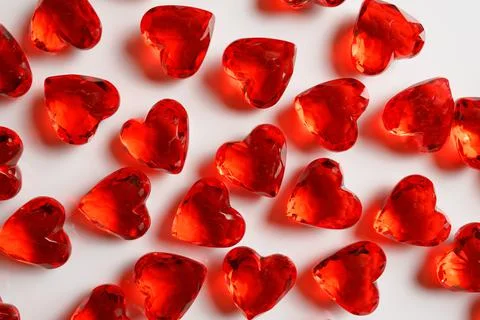 Full Frame Image of Sparkling Red Gemstone Hearts on a White Studio Background Stock Photos