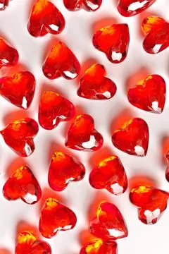 Full Frame Image of Sparkling Red Gemstone Hearts on a White Studio Background Stock Photos