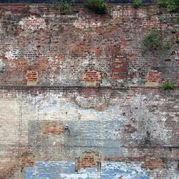  full frame image of a very large old brick wall with many patched and rep... Stock Photos