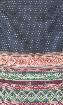 Full frame indigenous fabric pattern with colorful on a black background. Stock Photos