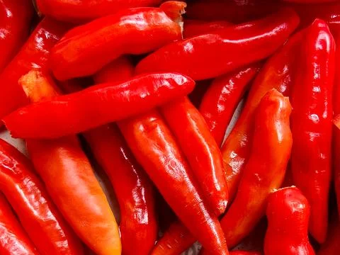 Full Frame Macro Shot of Fresh Vibrant Red Chili Peppers Background Stockfoto's