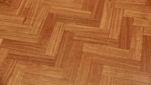Full frame mid brown coloured herringbone wood background with copyspace Stock Photos