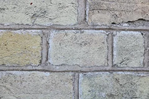 Full frame pale sandy brick wall background with copy space Stock Photos
