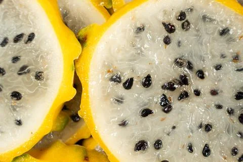 Full frame pattern of fresh sliced yellow pitahaya. Stock Photos