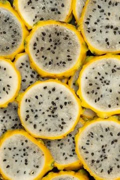 Full frame pattern of fresh sliced yellow pitahaya. Stock Photos