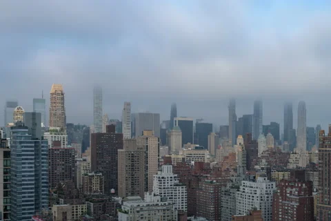 Full frame Penumbral Eclipse Moon over Midtown Skyline (3 of 3) Stock Footage 155159283