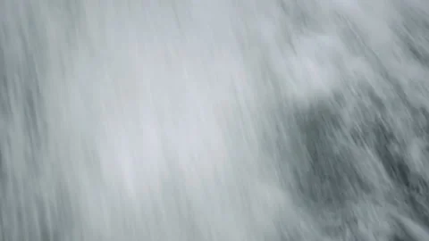 Full frame of powerful and dramatic waterfall. The water is flowing very quickly Video stock 130368973