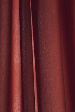 Full frame of red folded silk velvet fabric as background, vertical lines Stock Photos