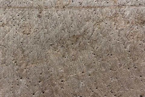 Full frame of sand full of tiny holes made by clams Stock Photos