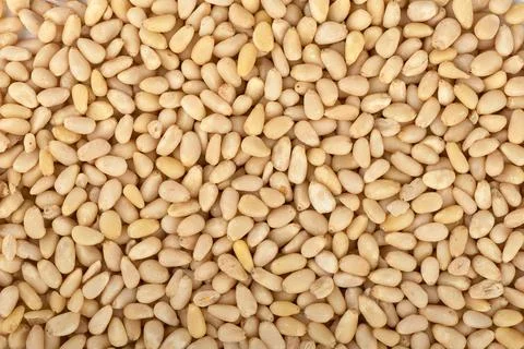 Full frame of shelled pine nuts as background. Stock Photos