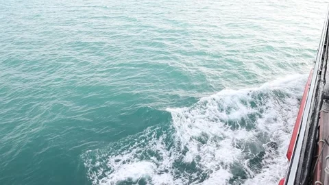 Full frame slow motion video of rough ocean surface with swirling whitewash Stock Footage 343479577