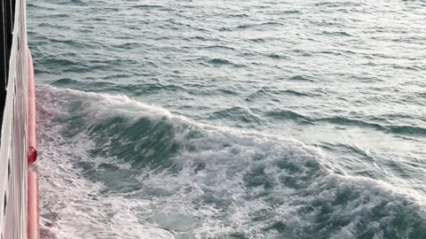 Full frame slow motion video of rough ocean surface with swirling whitewash Stock Footage 343480771