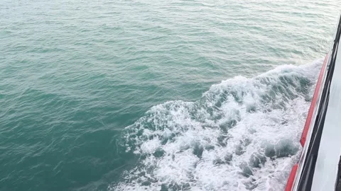 Full frame slow motion video of rough ocean surface with swirling whitewash Stock Footage 343480838